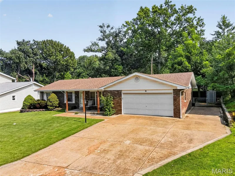 Third parking spot on driveway, wrapping around to the back patio — 208 Meadowlark Lane, St Charles, MO 63301