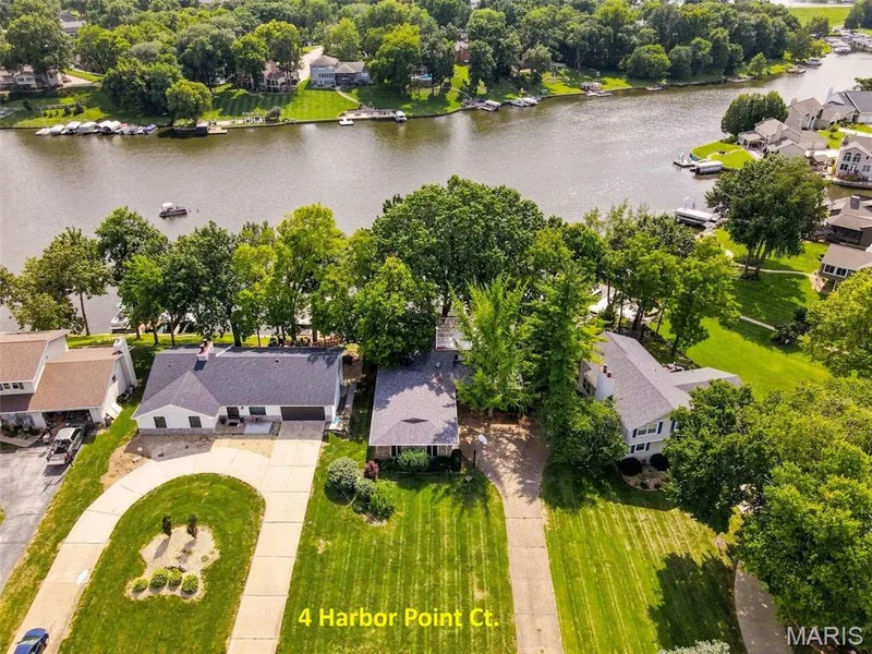 Huge 29x23 ft Garage - Home has a Newer Roof and Gutters - Newer Maintenance Free Wrap-around Deck - 2 Fireplaces - 4 Bedrooms - 3 Bathrooms - Walkout Lower Level — 4 Harbor Point Court, Lake St. Louis, MO 63367