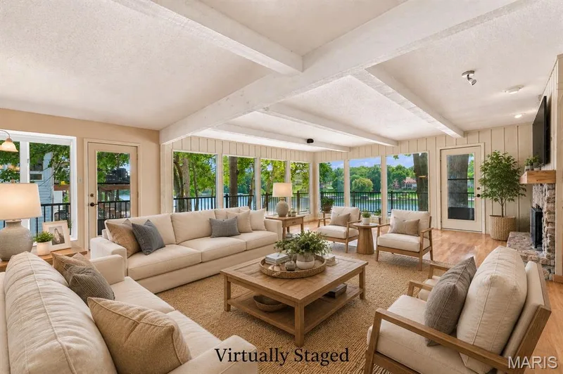 Virtually staged for your imagination.  Great Room with Beamed Ceiling and Stone Gas Fireplace in this open floor plan to the dining area and kitchen. — 4 Harbor Point Court, Lake St. Louis, MO 63367