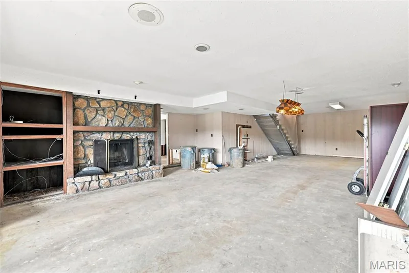 Walkout Lower Level with a family room, wood burning fireplace, rough-in wet bar, full bathroom rough-in, bedroom #4 and large laundry room area. — 4 Harbor Point Court, Lake St. Louis, MO 63367