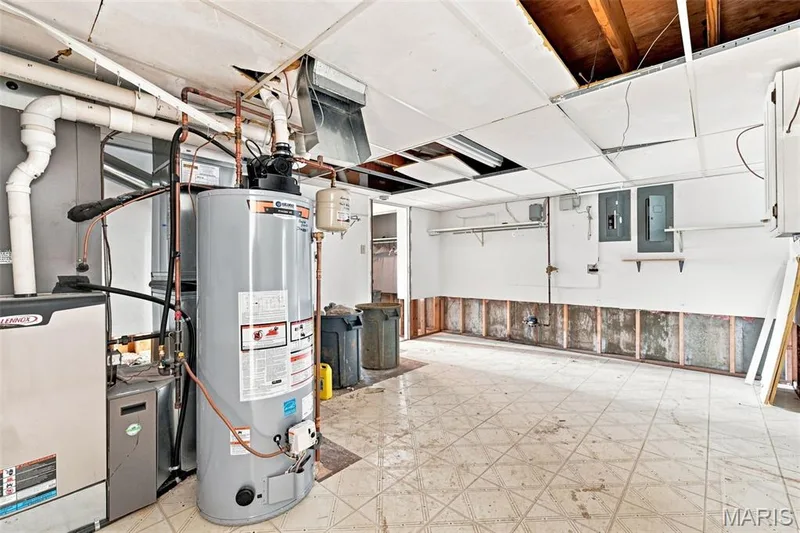 Walkout Lower Level with a family room, wood burning fireplace, rough-in wet bar, full bathroom rough-in, bedroom #4 and large laundry room area. — 4 Harbor Point Court, Lake St. Louis, MO 63367