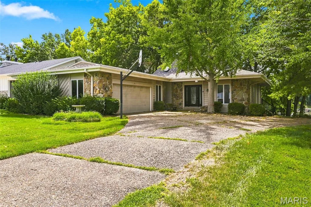 Huge Garage is 29 feet wide and 23 feet deep - Newer Roof and Gutters - Newer Maintenance Free Wrap-Around Deck - 2 Fireplaces - 4 Bedrooms - 3 Bathrooms - Walkout Lower Level — 4 Harbor Point Court, Lake St. Louis, MO 63367