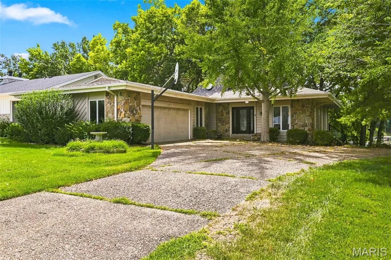 Huge Garage is 29 feet wide and 23 feet deep - Newer Roof and Gutters - Newer Maintenance Free Wrap-Around Deck - 2 Fireplaces - 4 Bedrooms - 3 Bathrooms - Walkout Lower Level — 4 Harbor Point Court, Lake St. Louis, MO 63367