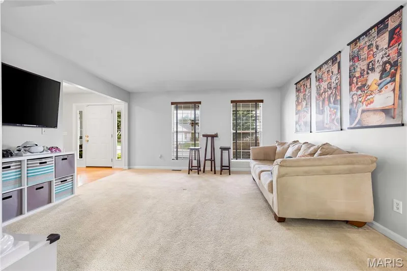 Formal Living Room is a great space of the home, with views out the front and ample natural light. — 2304 Bear Fountain Run, Wentzville, MO 63385
