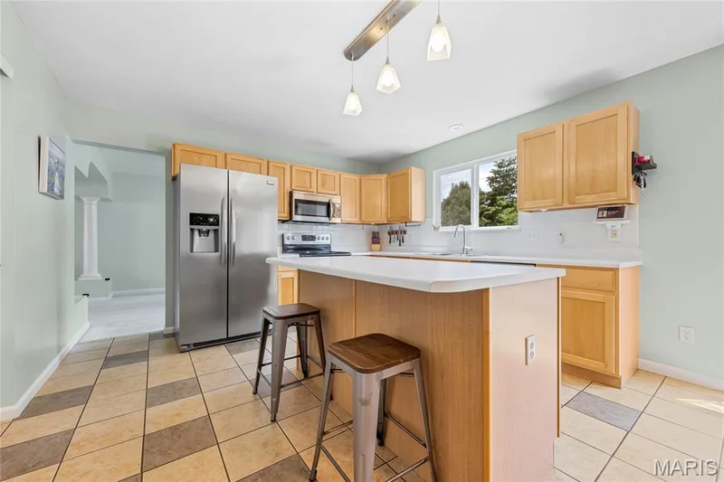 Stainless steel appliances are located in the kitchen — 2304 Bear Fountain Run, Wentzville, MO 63385