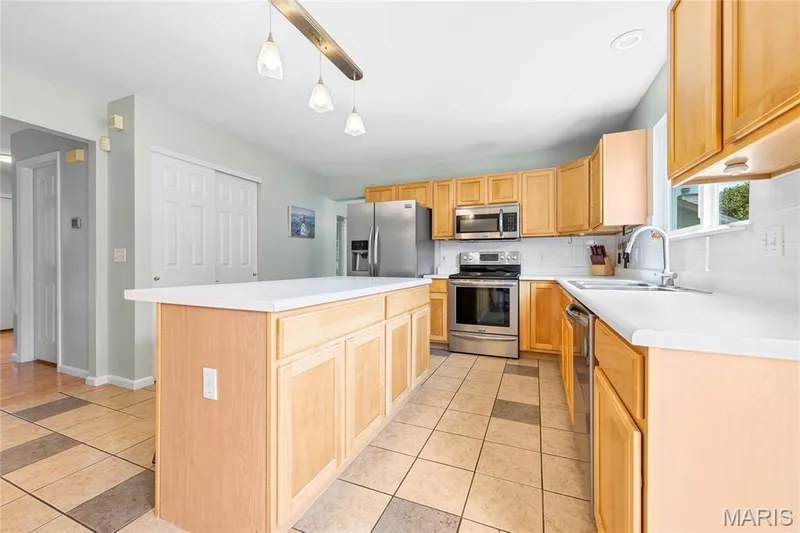 Centralized island has additional storage and prep areas. — 2304 Bear Fountain Run, Wentzville, MO 63385