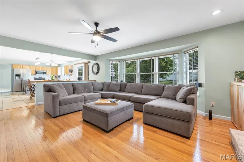 Spacious living room with huge bay window and more gleaming hardwood floors. — 2304 Bear Fountain Run, Wentzville, MO 63385