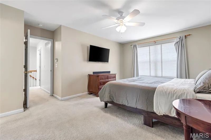 Spacious master suite has a large picture window and lighted ceiling fan. — 2304 Bear Fountain Run, Wentzville, MO 63385