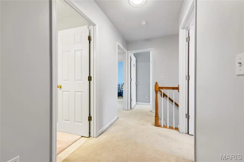 Hallway from the master suite opens to 3 additional bedrooms and a hall bath. — 2304 Bear Fountain Run, Wentzville, MO 63385