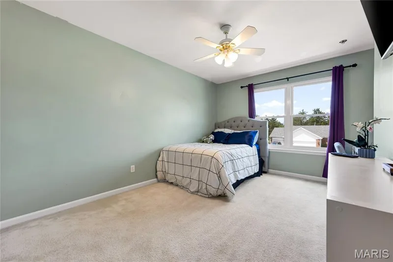 Secondary bedroom on the second level of Bear Fountain has a lighted ceiling fan and is carpeted. — 2304 Bear Fountain Run, Wentzville, MO 63385