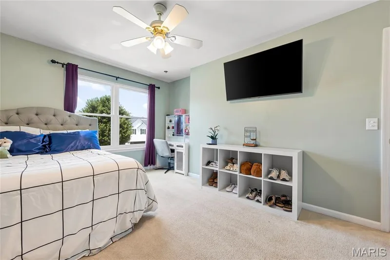 This secondary bedroom has a nook perfect for a vanity area with views out the front of the home — 2304 Bear Fountain Run, Wentzville, MO 63385