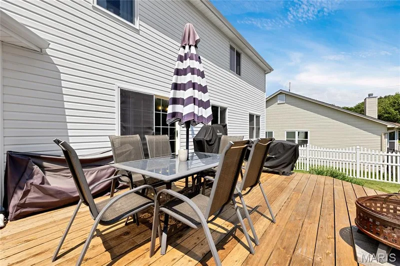 Expansive 15x18 wooden deck for enjoying time with the family or entertaining — 2304 Bear Fountain Run, Wentzville, MO 63385