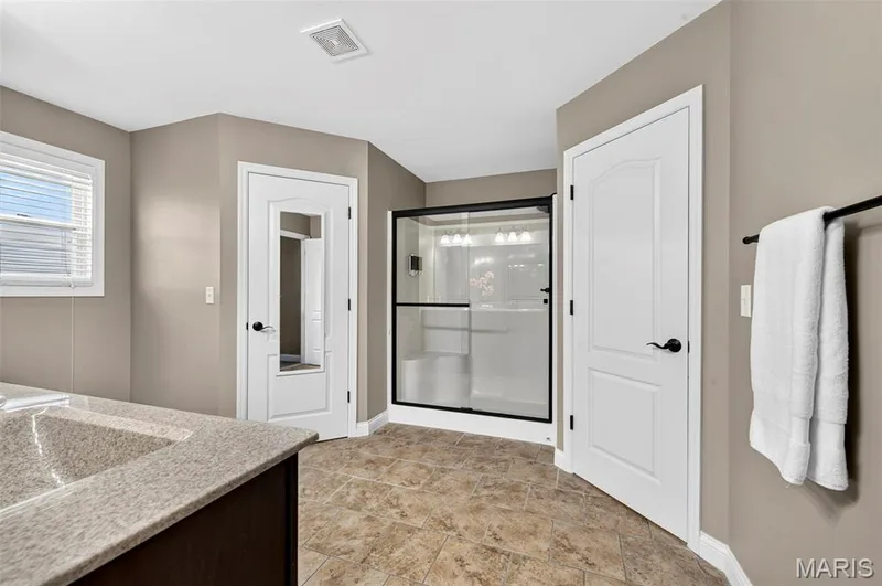 walk in closets on either side of the shower — 159 Shadow Pointe Drive, Wentzville, MO 63385