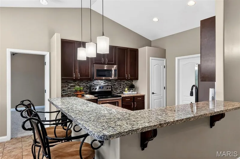 breakfast bar in kitchen — 159 Shadow Pointe Drive, Wentzville, MO 63385