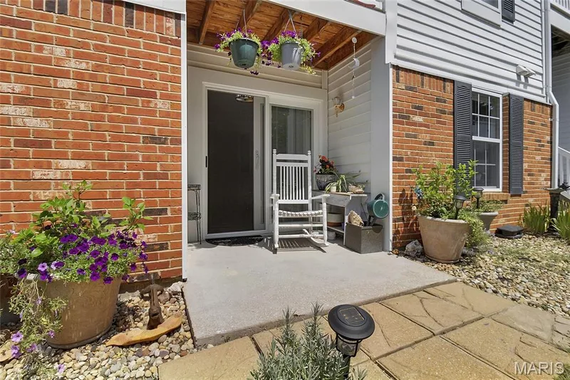 Private covered porch with storage area outside the slider from the kitchen — 16566 Victoria Crossing Drive #B, Wildwood, MO 63040