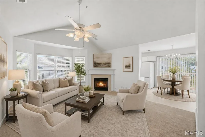 Virtually staged vaulted great room with bay window and gas fireplace. — 410 Benton Drive #L, St Peters, MO 63376