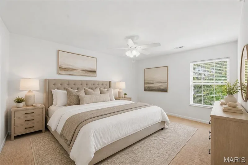 Virtually staged primary suite with walk in closet and attached full bath. — 410 Benton Drive #L, St Peters, MO 63376
