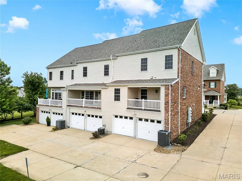 Multi-level residential structure featuring a combination of brick and siding exteriors — 2514 S Larksong Drive, Grover, MO 63040
