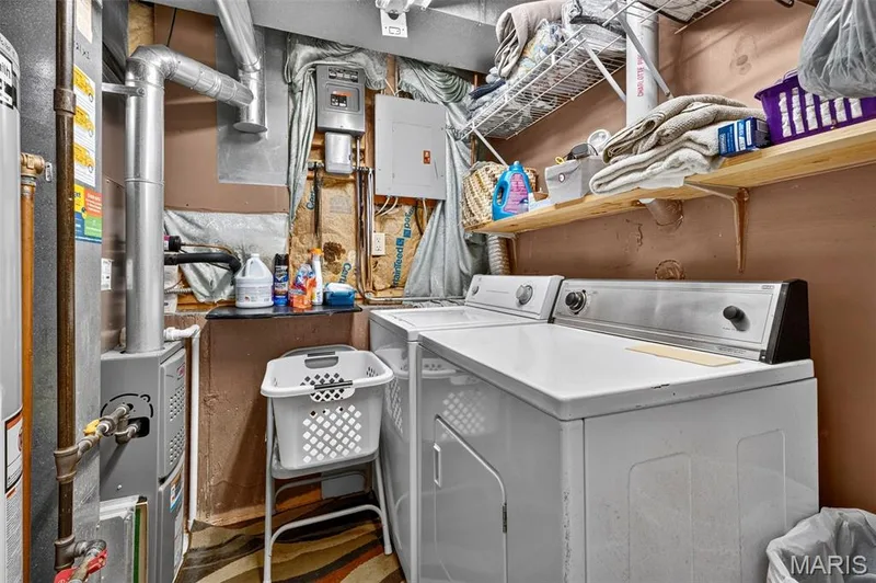 Dedicated utility area featuring a washer and dryer — 17 Kingspointe Court, St Peters, MO 63376
