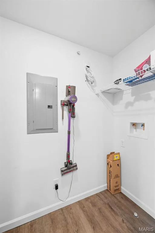 Laundry area featuring LVP flooring — 321 Bordeaux Way, St Peters, MO 63376