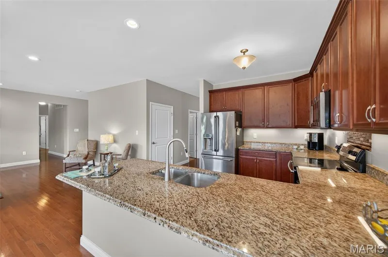 Breakfast bar overlooking the kitchen — 1125 Duxbury Lane, O'Fallon, MO 63366