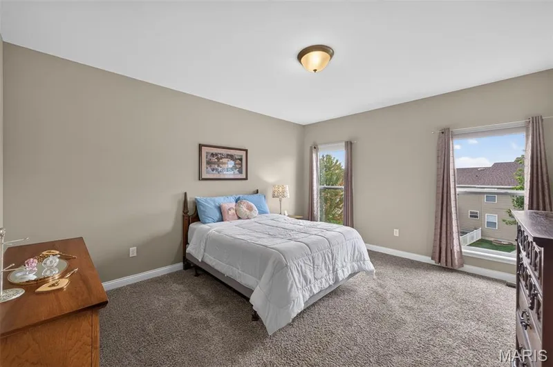 Inviting primary bedroom — 1125 Duxbury Lane, O'Fallon, MO 63366