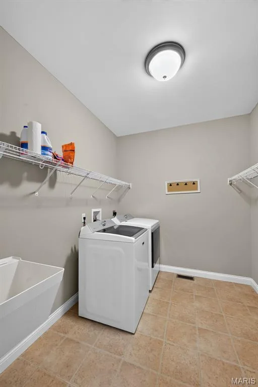 Laundry room with utility sink — 1125 Duxbury Lane, O'Fallon, MO 63366