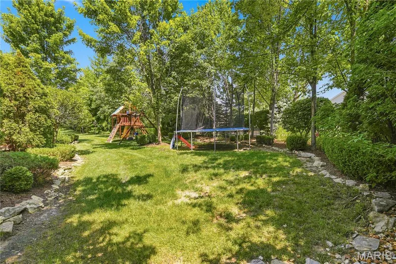 Beautiful landscaped back yard — 5500 Wooded Creek Drive, O'Fallon, MO 63304