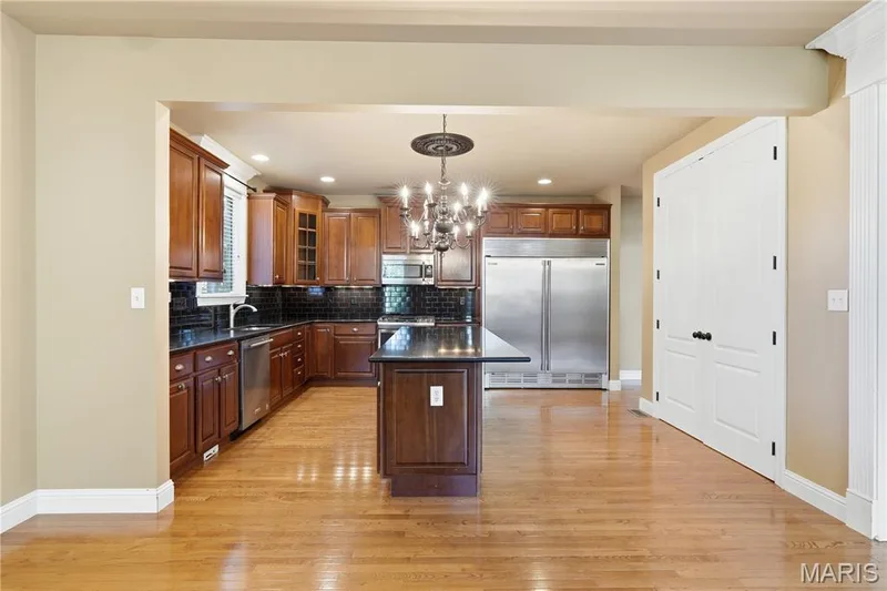 Looking into the kitchen from breakfast area — 5500 Wooded Creek Drive, O'Fallon, MO 63304