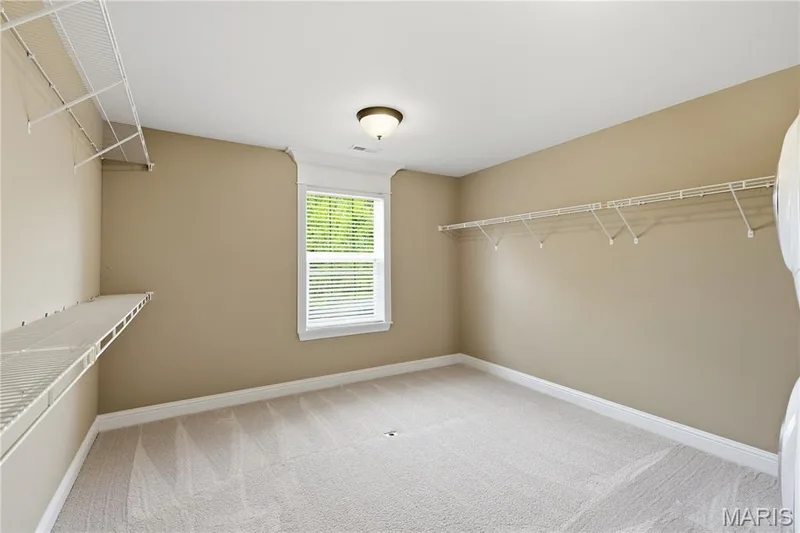 Large Primary walk in Closet with window — 5500 Wooded Creek Drive, O'Fallon, MO 63304