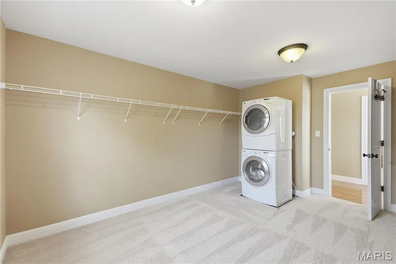 Additional laundry area located in primary closet — 5500 Wooded Creek Drive, O'Fallon, MO 63304
