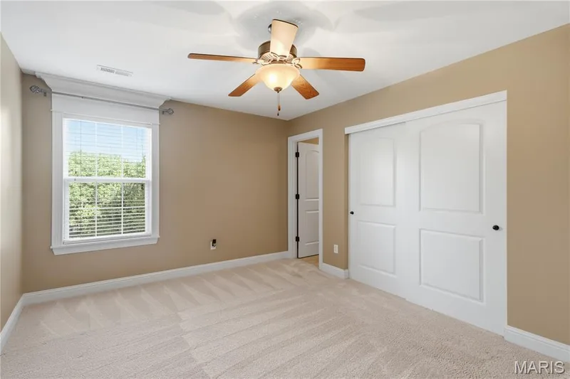 Additional bedroom featuring an attached bath — 5500 Wooded Creek Drive, O'Fallon, MO 63304