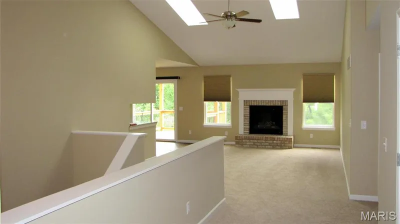 Great room into dining and deck. — 114 Fallon Villa Court, O'Fallon, MO 63368
