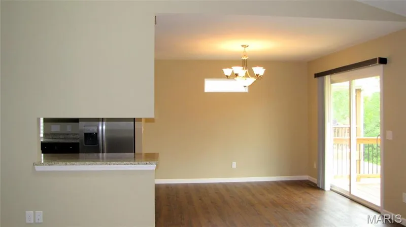 Dining area into kitchen — 114 Fallon Villa Court, O'Fallon, MO 63368