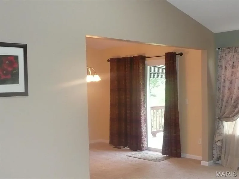 Great room into dining area, deck through glass slider. — 118 Fallon Villa Court, O'Fallon, MO 63368