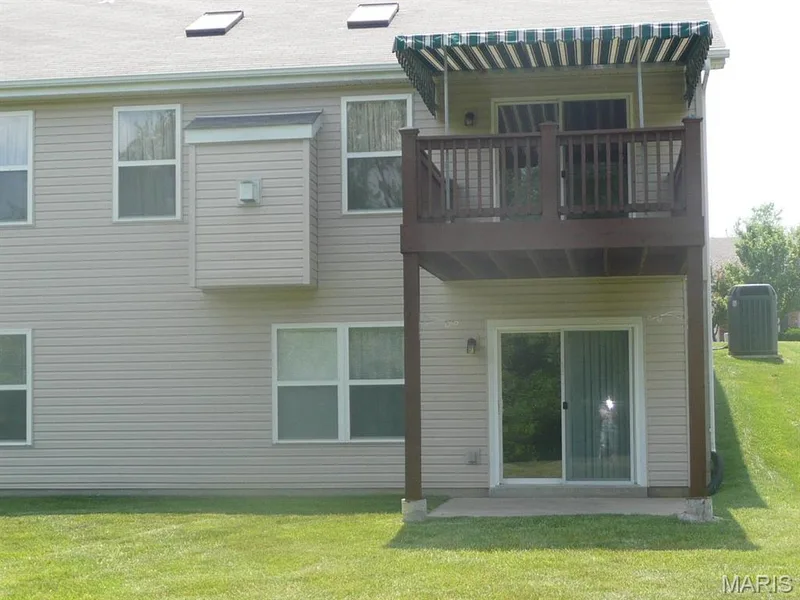 Back of villa, shows covered deck and patio. — 118 Fallon Villa Court, O'Fallon, MO 63368