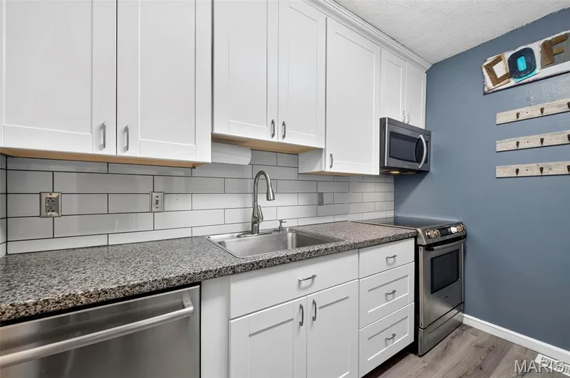 View of the Stainless Steel appliances, Dishwasher, Microwave, Stove/Oven Combo — 2701 Falcons Way #132, St Charles, MO 63303