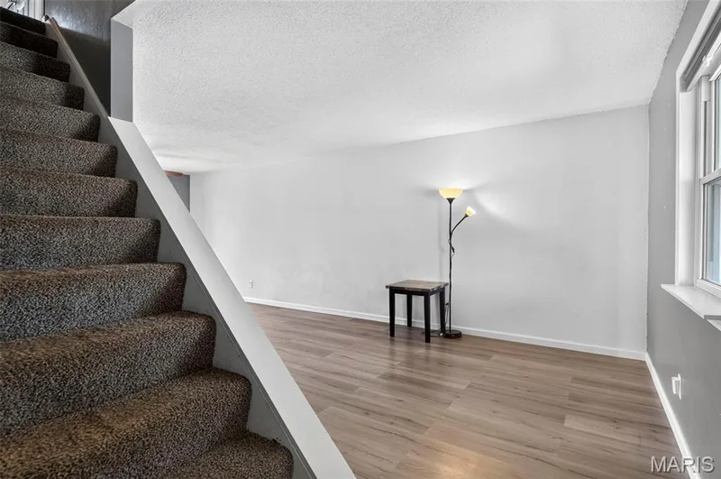 Stairway to the upper level and Living Room area — 2701 Falcons Way #132, St Charles, MO 63303