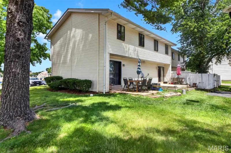 End unit, side yard, patio, large tree provides shaded area — 2701 Falcons Way #132, St Charles, MO 63303