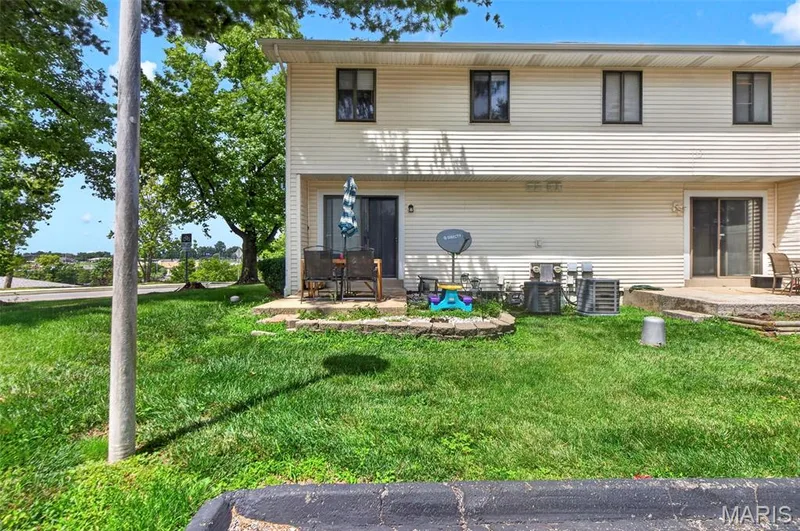 Patio, yard area and sliding glass door — 2701 Falcons Way #132, St Charles, MO 63303