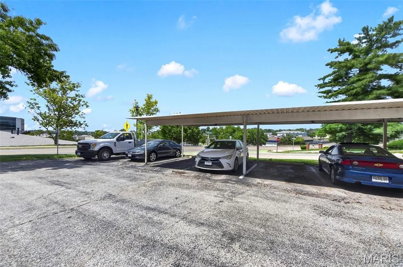 Unit is assigned the 1st parking spot and the 1st covered spot (3rd spot from the end) — 2701 Falcons Way #132, St Charles, MO 63303