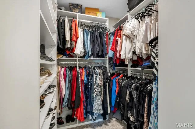 Primary walk-in closet. There is another wall not shown in the photos. Designed by St. Louis closet company. — 15578 Summer Lake Drive, Chesterfield, MO 63017