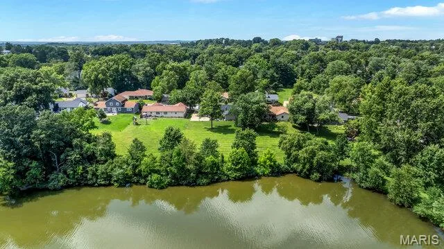 Lake view toward the home. Neighbors are often seen boating and fishing on the lake. When it freezes the kids skate on the lake. — 15578 Summer Lake Drive, Chesterfield, MO 63017