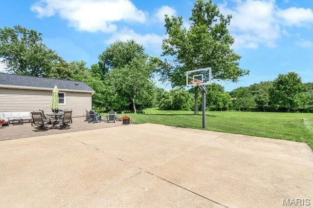 Basketball hoop by the 6 pad driveway provides the perfect 1/2 court. — 15578 Summer Lake Drive, Chesterfield, MO 63017