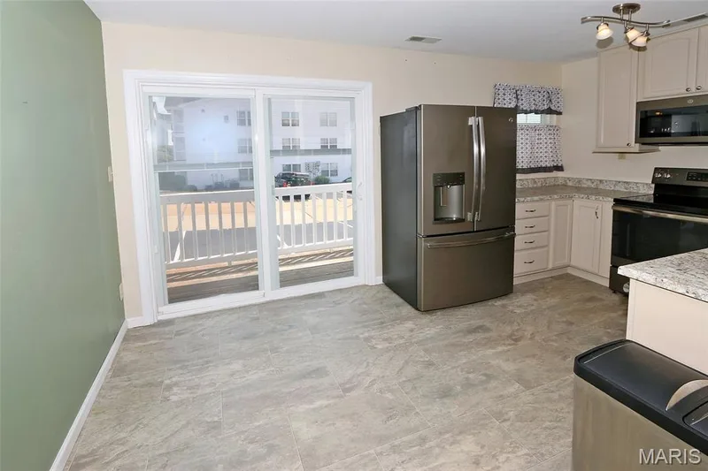 Patio doors exit onto balcony — 116 Jubilee Hill Drive #G, Wildwood, MO 63040