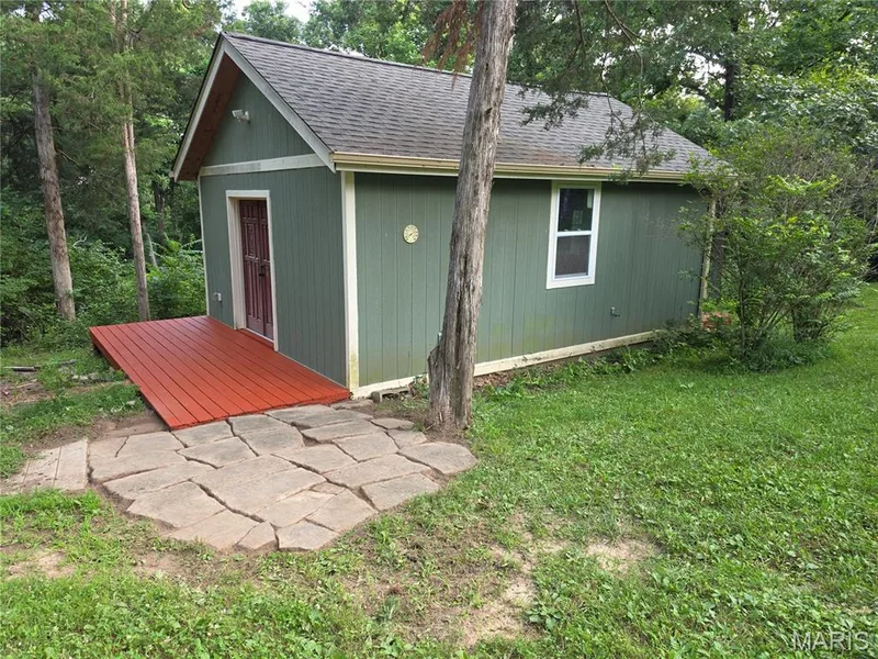 Wood shop/She Shed with front and back deck and stone patio. 23Ft.x 18 Ft. 2x6 stud built, insulated, with heating and cooling. — 44 Wilderness Lane, Defiance, MO 63341