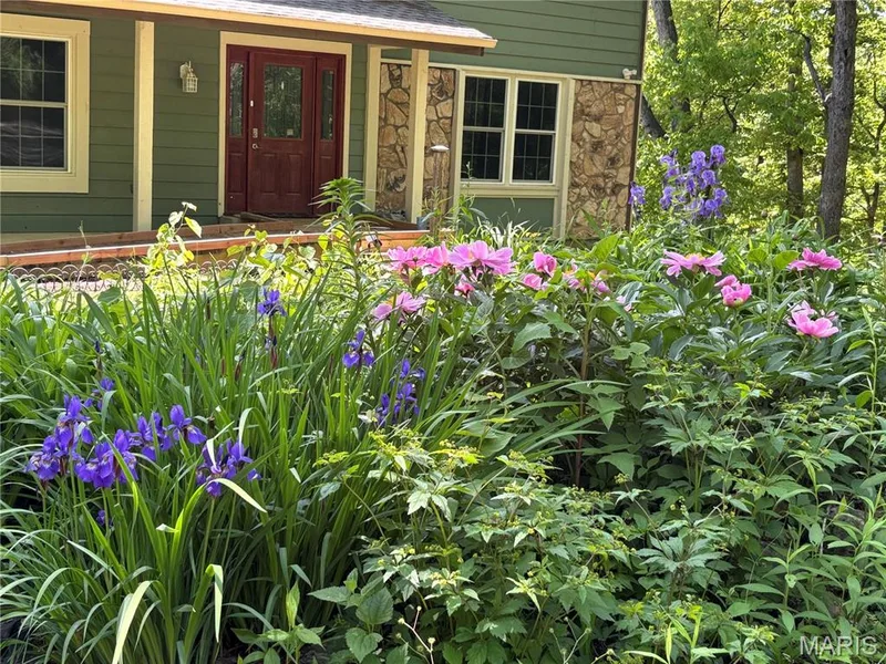 Beautifully landscaped in a natural setting — 44 Wilderness Lane, Defiance, MO 63341