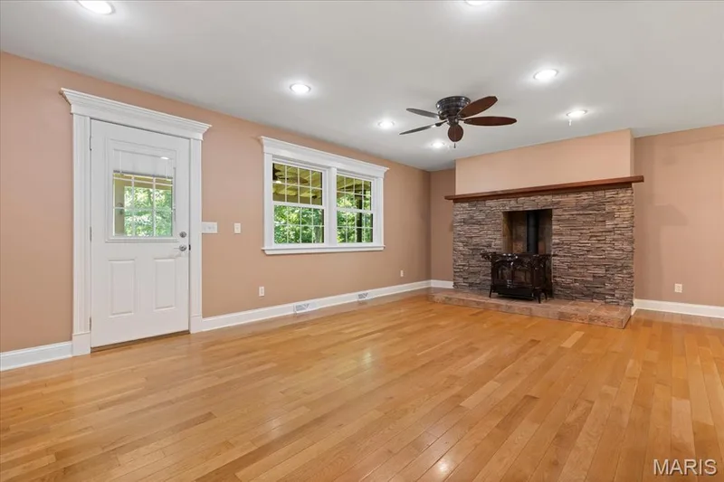 Great room displaying door to back deck — 44 Wilderness Lane, Defiance, MO 63341