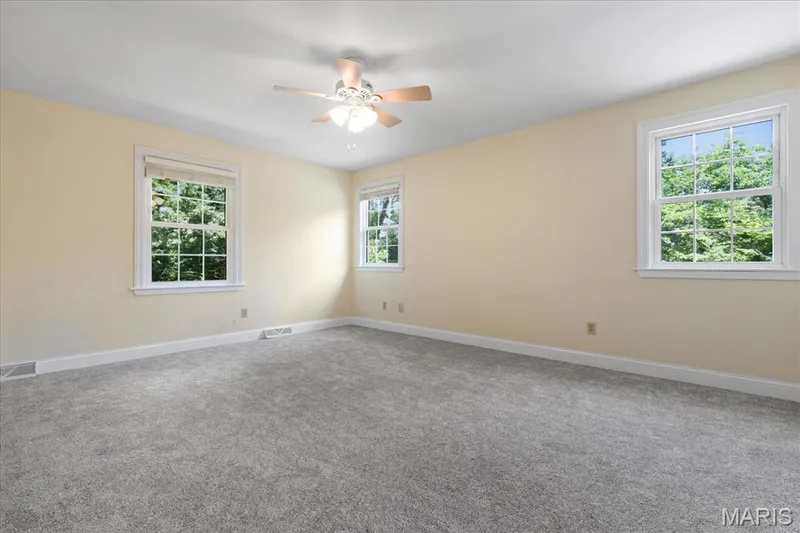 Primary Bedroom with new carpeting, all windows on first and second floor ae 3 pane, tilt in Insulated. — 44 Wilderness Lane, Defiance, MO 63341