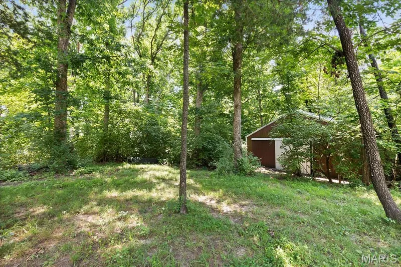View of Barn.32ft. x 24 ft. 3 stall plus barn with room for tack and upper hay loft storage. — 44 Wilderness Lane, Defiance, MO 63341